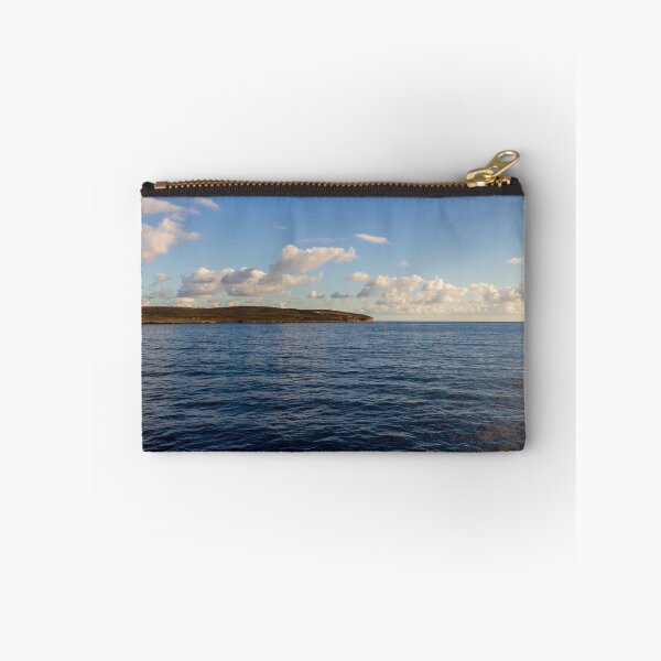 Item preview, Calm Ocean Horizon With Cloud-Filled Sky and Distant Coastal Island at Golden Hour designed and sold by Nmallia.
