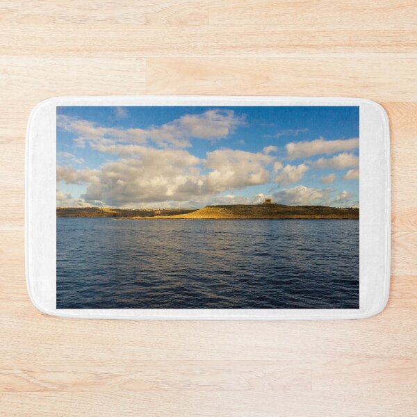 Item preview, Calm Ocean Horizon With Cloud-Filled Sky and Distant Coastal Island at Golden Hour designed and sold by Nmallia.