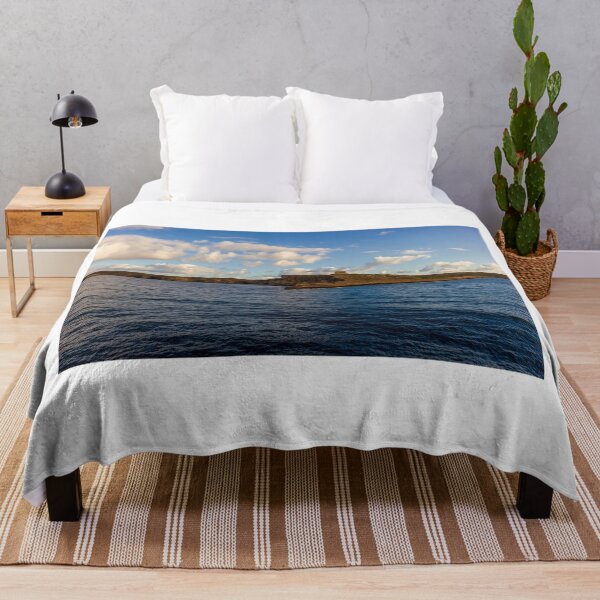 Item preview, Calm Ocean Horizon With Cloud-Filled Sky and Distant Coastal Island at Golden Hour designed and sold by Nmallia.