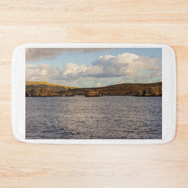 Item preview, Calm Ocean Horizon With Cloud-Filled Sky and Distant Coastal Island at Golden Hour designed and sold by Nmallia.