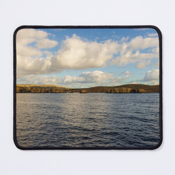Item preview, Calm Ocean Horizon With Cloud-Filled Sky and Distant Coastal Island at Golden Hour designed and sold by Nmallia.