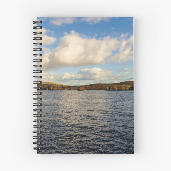 Item preview, Calm Ocean Horizon With Cloud-Filled Sky and Distant Coastal Island at Golden Hour designed and sold by Nmallia.