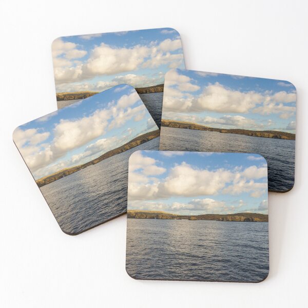 Item preview, Calm Ocean Horizon With Cloud-Filled Sky and Distant Coastal Island at Golden Hour designed and sold by Nmallia.