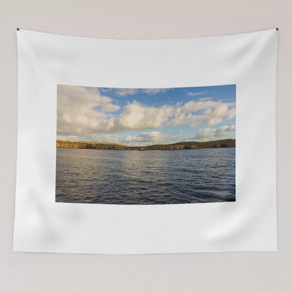 Item preview, Calm Ocean Horizon With Cloud-Filled Sky and Distant Coastal Island at Golden Hour designed and sold by Nmallia.