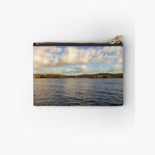 Item preview, Calm Ocean Horizon With Cloud-Filled Sky and Distant Coastal Island at Golden Hour designed and sold by Nmallia.