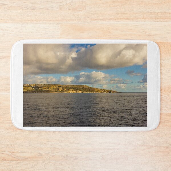 Item preview, Calm Ocean Horizon With Cloud-Filled Sky and Distant Coastal Island at Golden Hour designed and sold by Nmallia.
