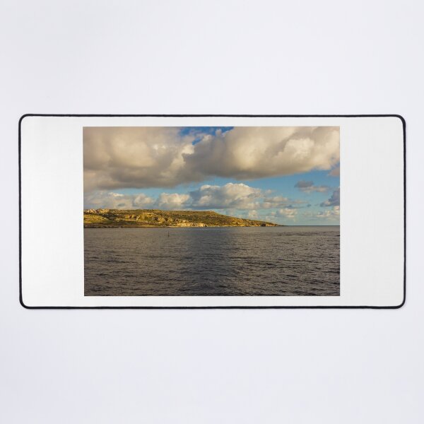 Item preview, Calm Ocean Horizon With Cloud-Filled Sky and Distant Coastal Island at Golden Hour designed and sold by Nmallia.