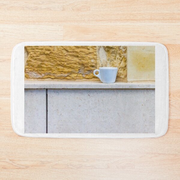 Item preview, White Coffee Cup on Stone Ledge Against Textured Yellow Wall Minimal Still Life designed and sold by Nmallia.