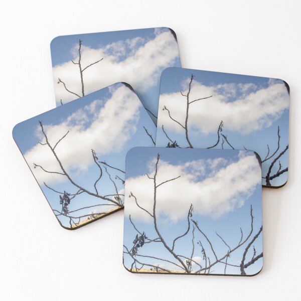 Item preview, Bare Tree Branches Silhouetted Against Blue Sky With Single Cloud Over Arid Landscape designed and sold by Nmallia.