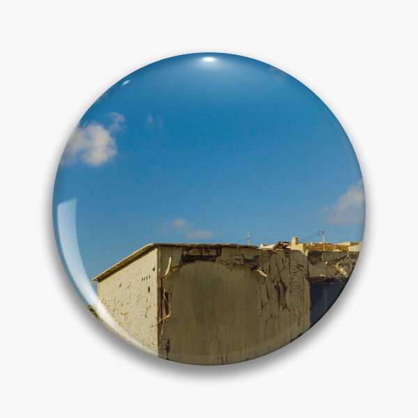 Item preview, Weathered Rural Shed With Peeling Paint And Blue Door Under Bright Cloudy Sky designed and sold by Nmallia.