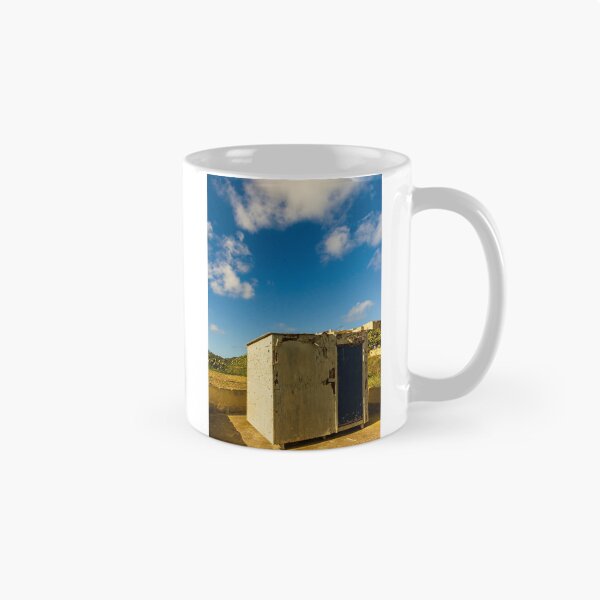 Item preview, Weathered Rural Shed With Peeling Paint And Blue Door Under Bright Cloudy Sky designed and sold by Nmallia.