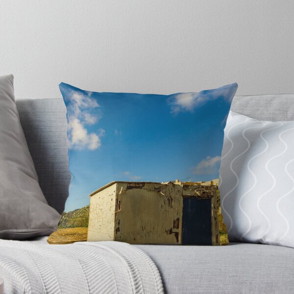 Item preview, Weathered Rural Shed With Peeling Paint And Blue Door Under Bright Cloudy Sky designed and sold by Nmallia.