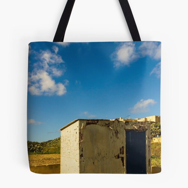 Item preview, Weathered Rural Shed With Peeling Paint And Blue Door Under Bright Cloudy Sky designed and sold by Nmallia.