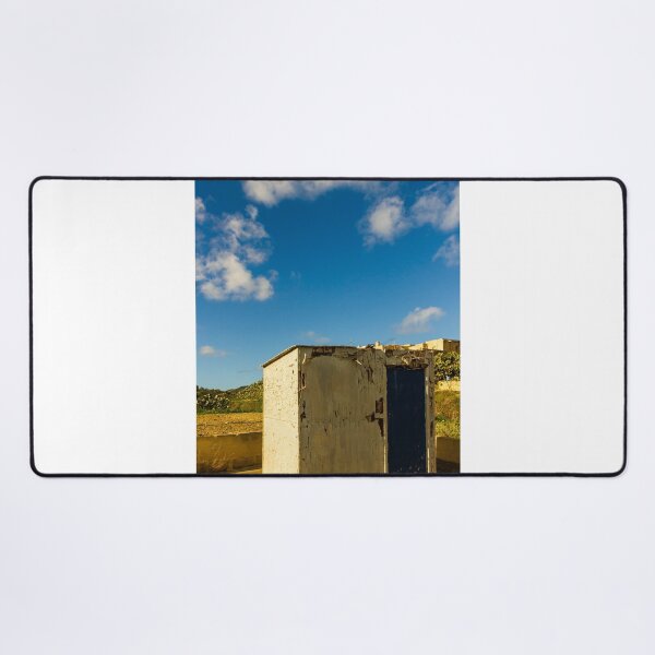 Item preview, Weathered Rural Shed With Peeling Paint And Blue Door Under Bright Cloudy Sky designed and sold by Nmallia.