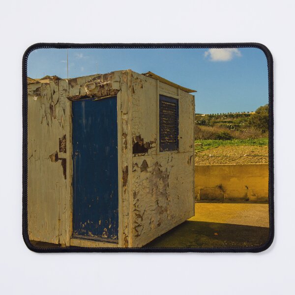 Item preview, Weathered Rural Shed With Peeling Paint And Blue Door Under Bright Cloudy Sky designed and sold by Nmallia.