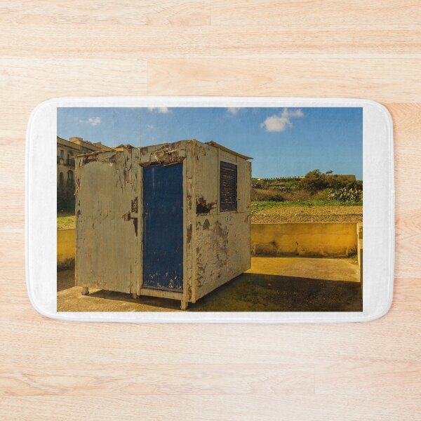 Item preview, Weathered Rural Shed With Peeling Paint And Blue Door Under Bright Cloudy Sky designed and sold by Nmallia.