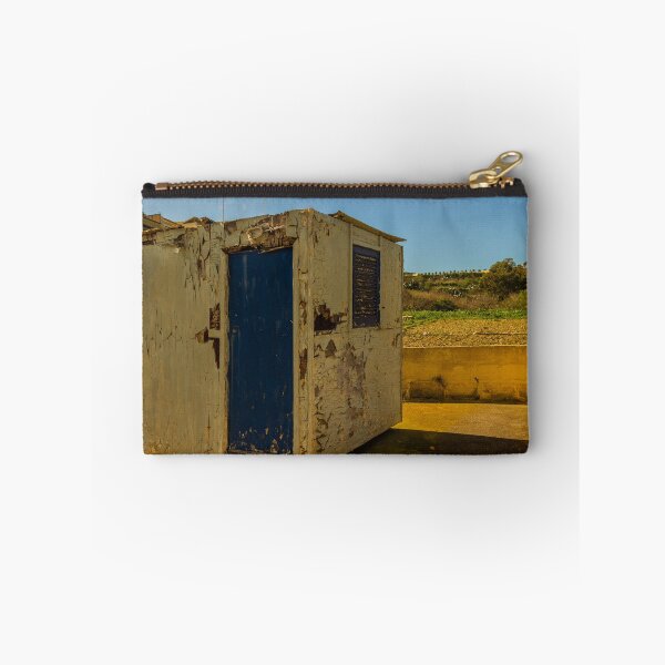 Item preview, Weathered Rural Shed With Peeling Paint And Blue Door Under Bright Cloudy Sky designed and sold by Nmallia.