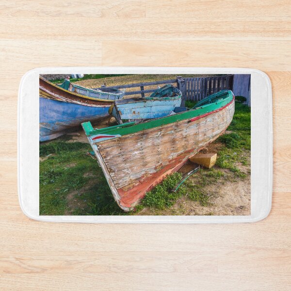 Item preview, Weathered Wooden Fishing Boats On Shore With Peeling Paint And Rustic Mediterranean Charm designed and sold by Nmallia.