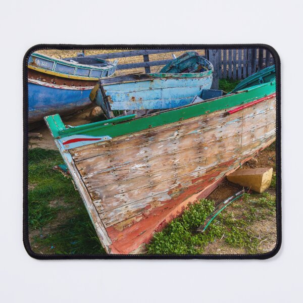 Item preview, Weathered Wooden Fishing Boats On Shore With Peeling Paint And Rustic Mediterranean Charm designed and sold by Nmallia.