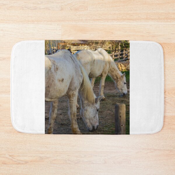 Item preview, White Horses Grazing In Rustic Farm Paddock At Sunset With Wooden Fence And Stable designed and sold by Nmallia.