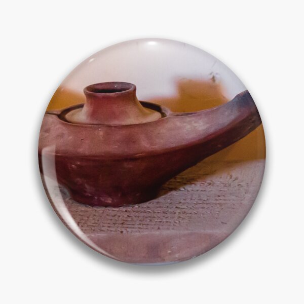 Item preview, Antique Terracotta Oil Lamp On Wooden Shelf With Warm Shadow And Rustic Texture designed and sold by Nmallia.