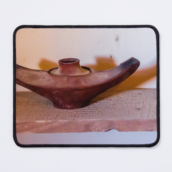 Item preview, Antique Terracotta Oil Lamp On Wooden Shelf With Warm Shadow And Rustic Texture designed and sold by Nmallia.