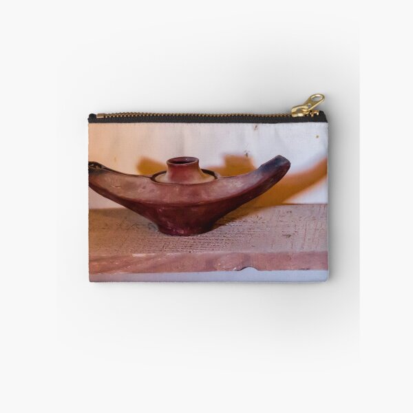Item preview, Antique Terracotta Oil Lamp On Wooden Shelf With Warm Shadow And Rustic Texture designed and sold by Nmallia.