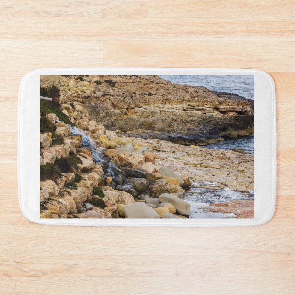 Item preview, Rocky Coastal Cliff Over Turquoise Ocean Waves With Eroded Limestone Seascape designed and sold by Nmallia.