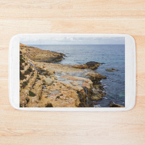 Item preview, Rocky Coastal Cliff Over Turquoise Ocean Waves With Eroded Limestone Seascape designed and sold by Nmallia.