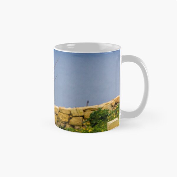 Item preview, Lonely Bare Tree With Small Bird by Stone Wall Overlooking Calm Sea and Wildflower Coastline designed and sold by Nmallia.