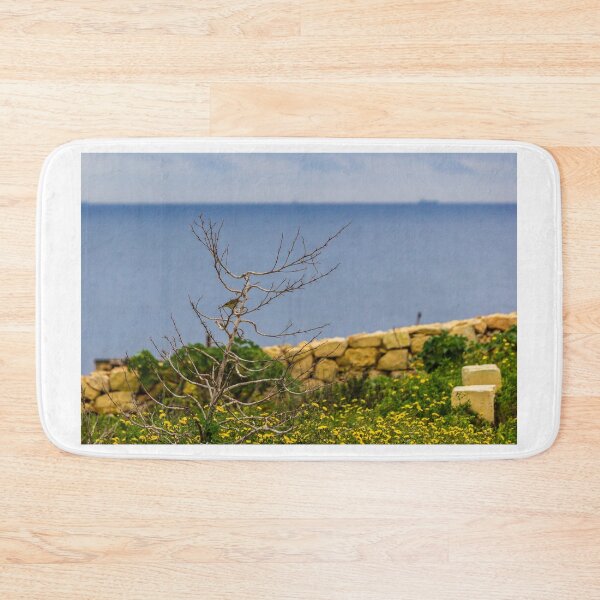 Item preview, Lonely Bare Tree With Small Bird by Stone Wall Overlooking Calm Sea and Wildflower Coastline designed and sold by Nmallia.
