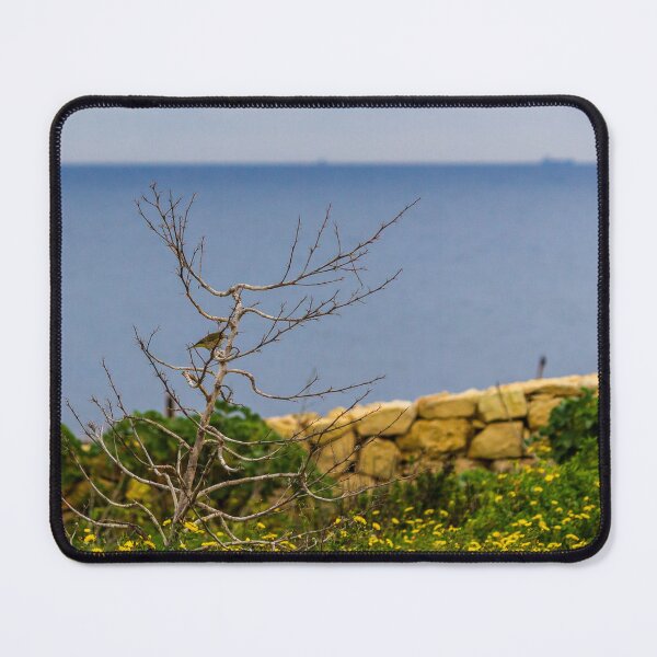 Item preview, Lonely Bare Tree With Small Bird by Stone Wall Overlooking Calm Sea and Wildflower Coastline designed and sold by Nmallia.