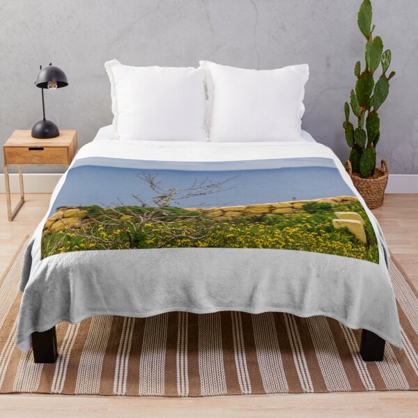 Item preview, Lonely Bare Tree With Small Bird by Stone Wall Overlooking Calm Sea and Wildflower Coastline designed and sold by Nmallia.