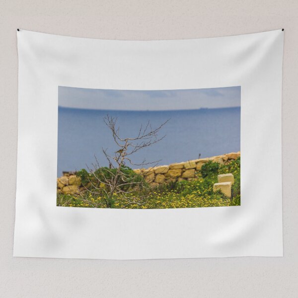 Item preview, Lonely Bare Tree With Small Bird by Stone Wall Overlooking Calm Sea and Wildflower Coastline designed and sold by Nmallia.