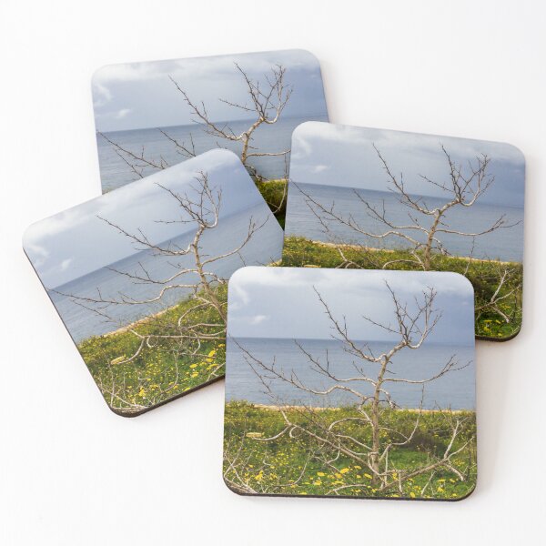 Item preview, Lonely Bare Tree With Small Bird by Stone Wall Overlooking Calm Sea and Wildflower Coastline designed and sold by Nmallia.