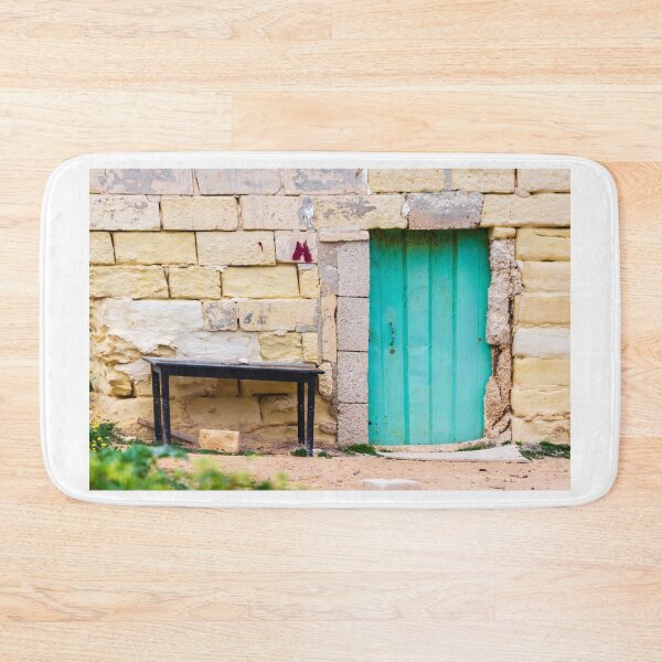 Item preview, Turquoise Wooden Door Set in Weathered Stone Wall With Old Black Table and Rustic Charm designed and sold by Nmallia.