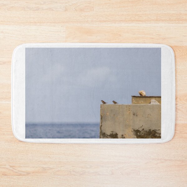 Item preview, Two Sparrows Perched on Weathered Concrete Wall Overlooking Calm Sea and Soft Sky designed and sold by Nmallia.