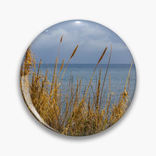 Item preview, Stormy Coastal Seascape With Golden Reeds in Foreground and Calm Blue Sea Horizon designed and sold by Nmallia.