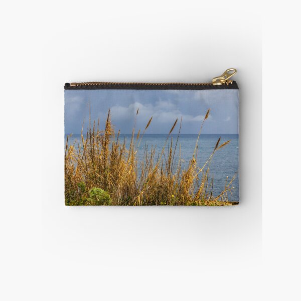 Item preview, Stormy Coastal Seascape With Golden Reeds in Foreground and Calm Blue Sea Horizon designed and sold by Nmallia.