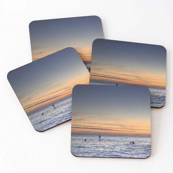 Item preview, Surfers and a stand-up paddleboarder enjoying the sunrise at Cabarita beach designed and sold by Rachel Elizabeth Photography.