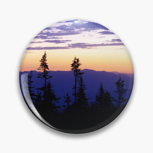 Item preview, Silhouetted pines stand against a glowing sunset over layered mountain ridges designed and sold by Kabbrisons.