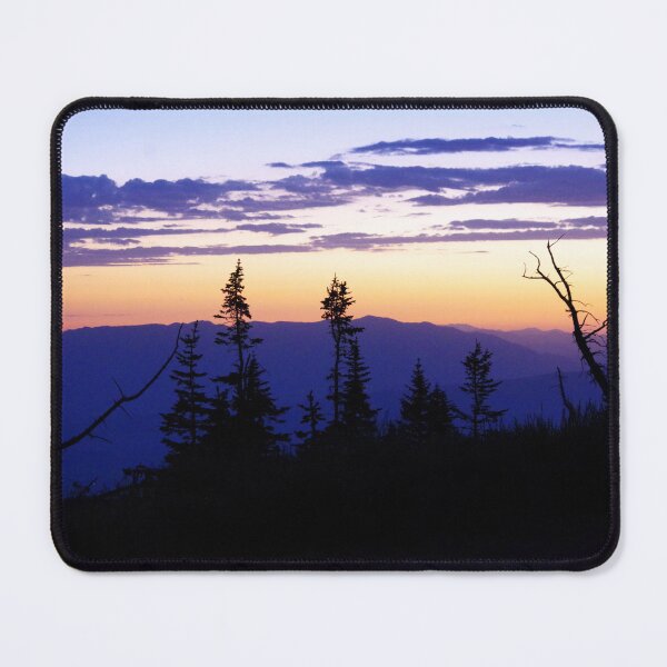 Item preview, Silhouetted pines stand against a glowing sunset over layered mountain ridges designed and sold by Kabbrisons.
