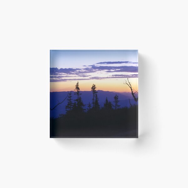 Item preview, Silhouetted pines stand against a glowing sunset over layered mountain ridges designed and sold by Kabbrisons.