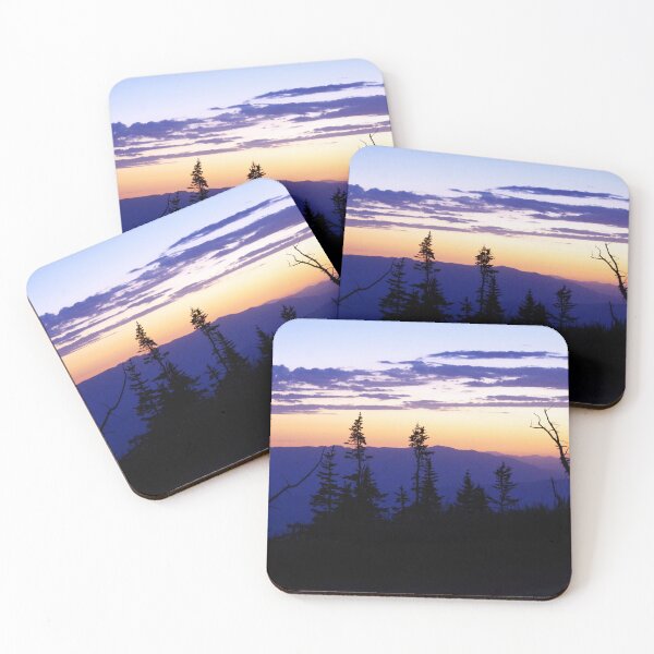 Item preview, Silhouetted pines stand against a glowing sunset over layered mountain ridges designed and sold by Kabbrisons.