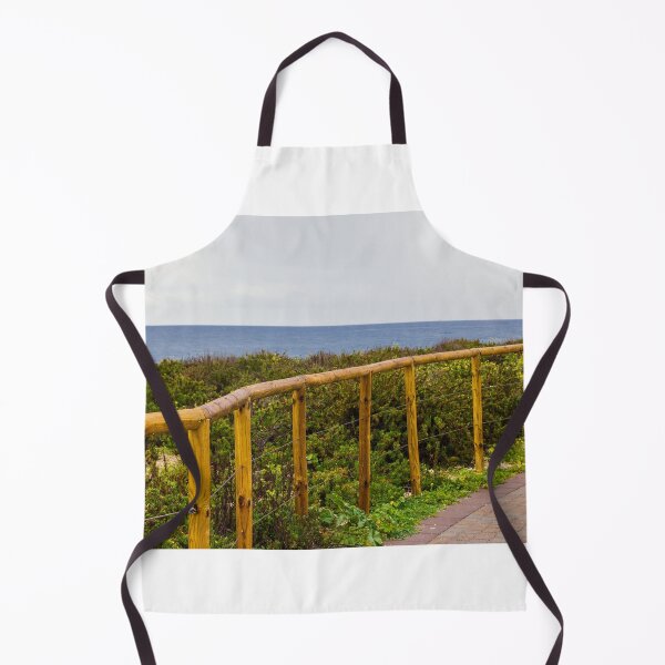 Item preview, Curved Wooden Fence Along Coastal Path Overlooking Ocean and Lush Dunes on Overcast Day designed and sold by Nmallia.