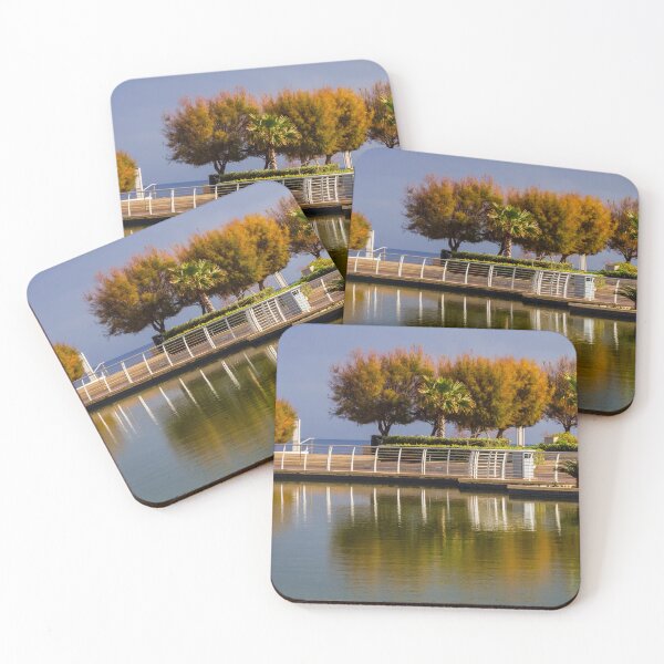 Item preview, Waterfront Promenade With Palm Trees And Reflections On Calm Urban Lagoon designed and sold by Nmallia.