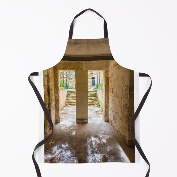 Item preview, Abandoned Stone Corridor Leading To Sunlit Stairway And Overgrown Courtyard Through A Narrow Doorway designed and sold by Nmallia.