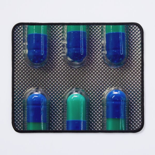 Item preview, Blue and Green Capsules in Blister Pack Close-Up, Medicine and Pharmaceutical Health Concept designed and sold by Nmallia.