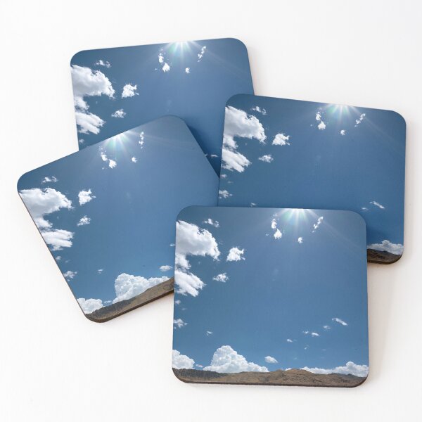 Item preview, Cumulus clouds against deep blue sky with flare designed and sold by lisavonbiela.