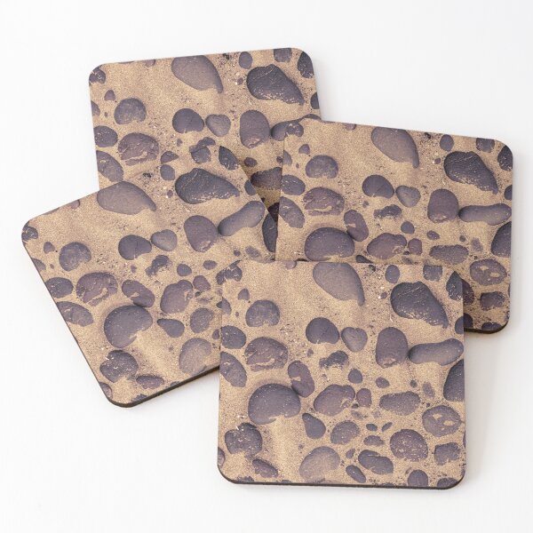 Item preview, Directly above shot of lava stones in the sand designed and sold by kristofbellens.